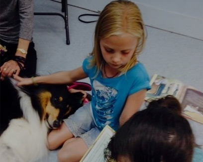 girl on floor with dog