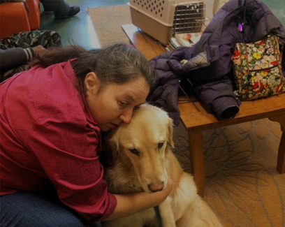 woman hugging a dog