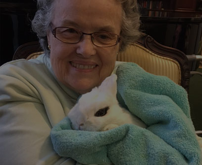 women holding a bunny rabbit
